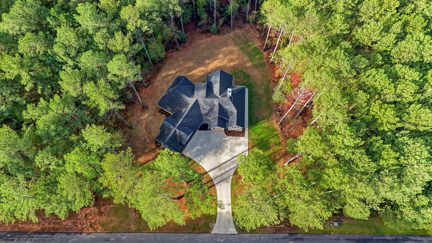 Aerial drone view of a completed shingle roof inspection by S&S Roofing in Hickory, NC