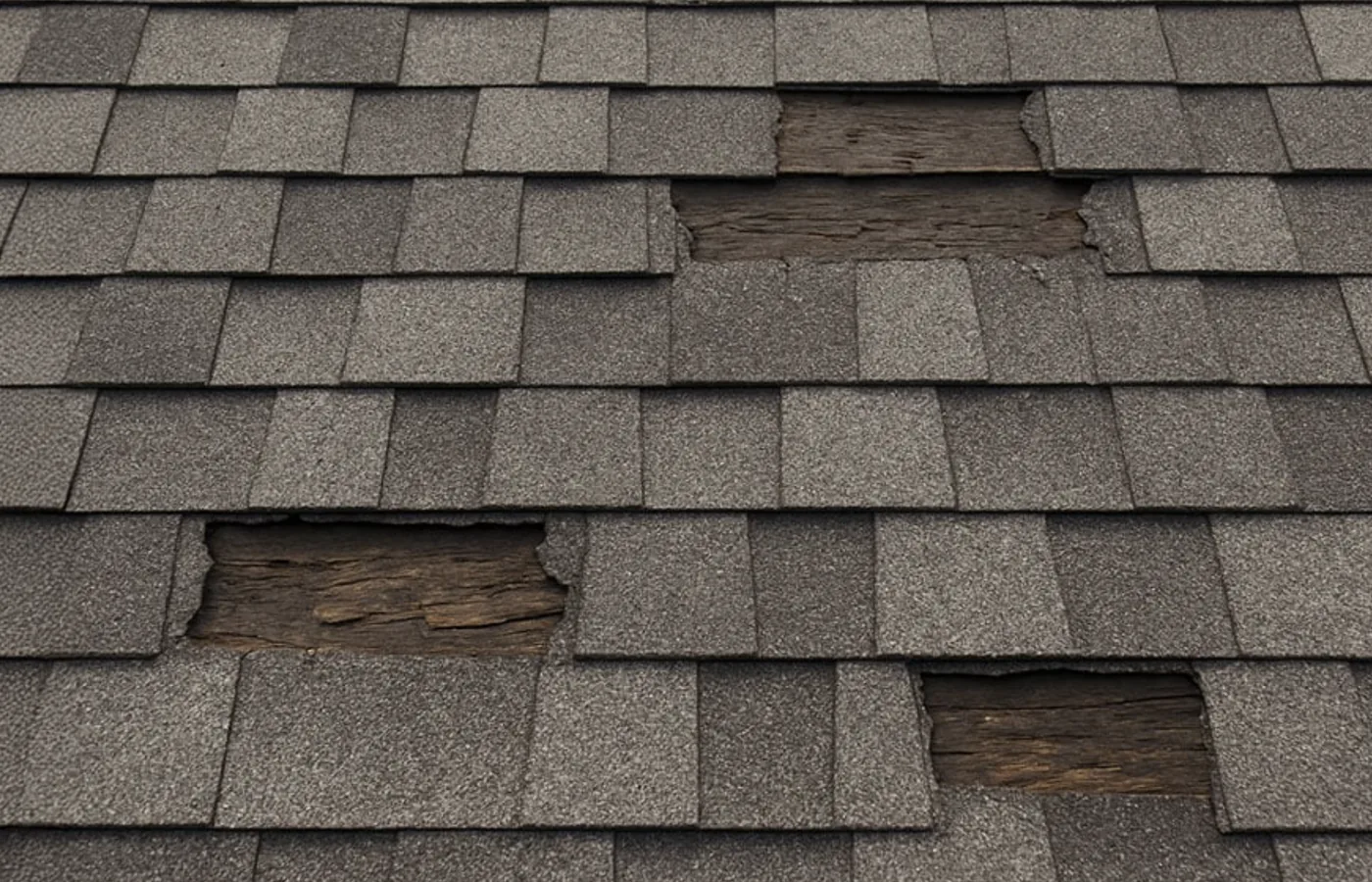 Storm-damaged shingles being repaired by S&S Roofing in Hickory, NC