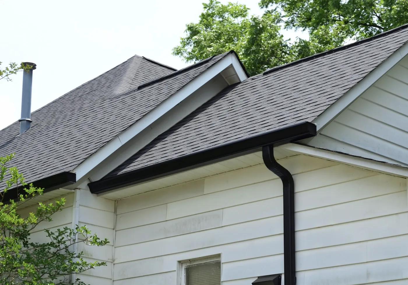 Seamless aluminum gutters and downspout installed by S&S Roofing in Hickory, NC